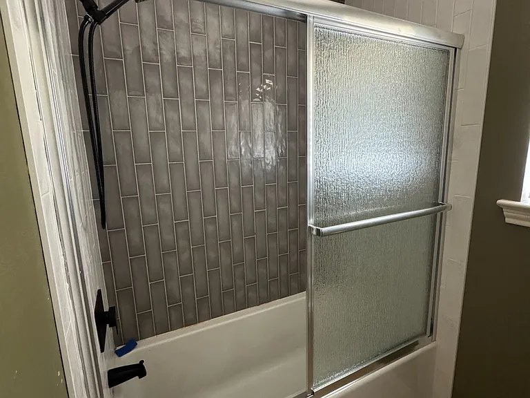__ Guest Bathroom
"Sleek and stylish guest bathroom with a walk-in tiled shower, updated bathtub, and a clean, modern vibe."