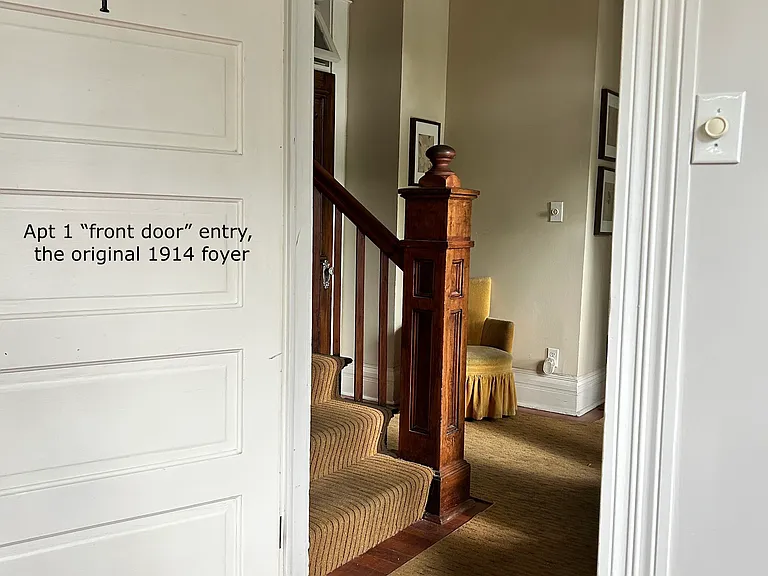 door to the 15 x 13 bedroom into the original foyer entrance and front door to the building