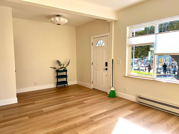 Living room nook and coat closet. The last tenant used this space as a small WFH area.