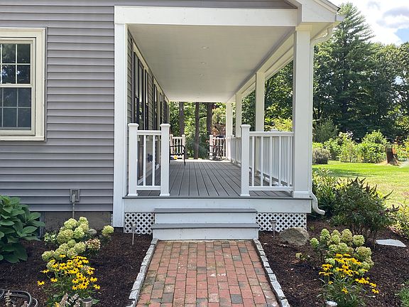 Brick walkway leading to farmers porch