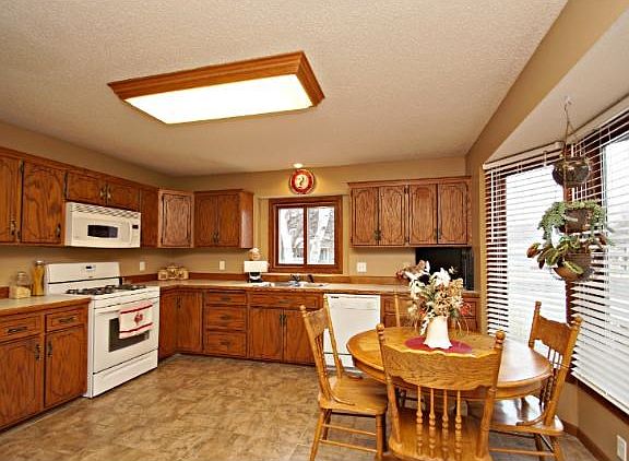 Over sized eat in kitchen with plenty of cabinet and counter space.