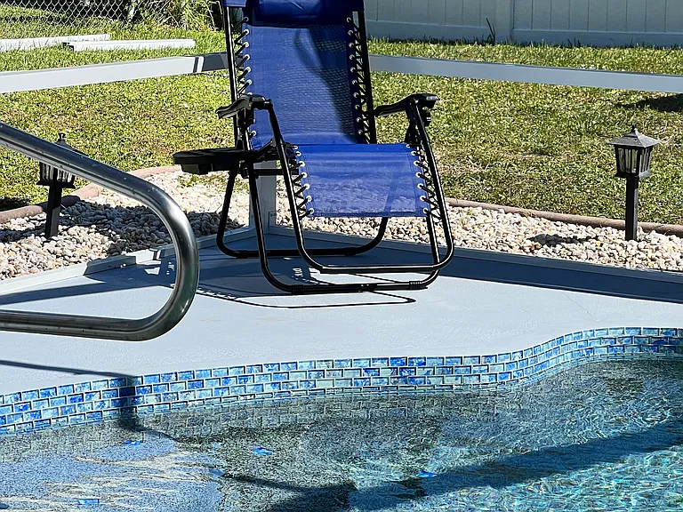 1 of 2 Lounge chairs by the pool