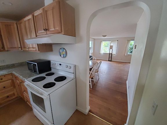 doorway from kitchen into dining area 
 and living room