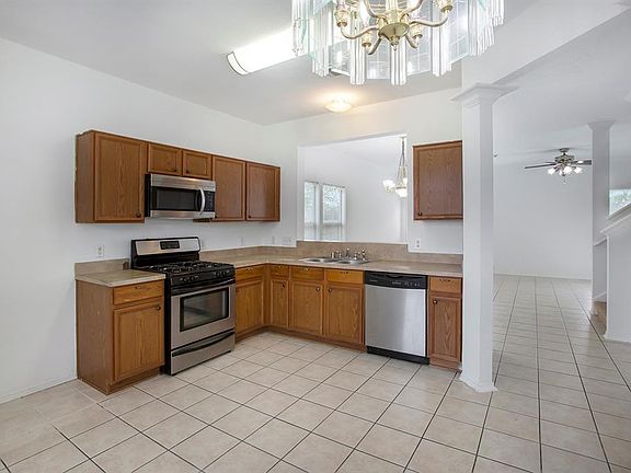 Lots of counter space and cabinets for storage in this kitchen