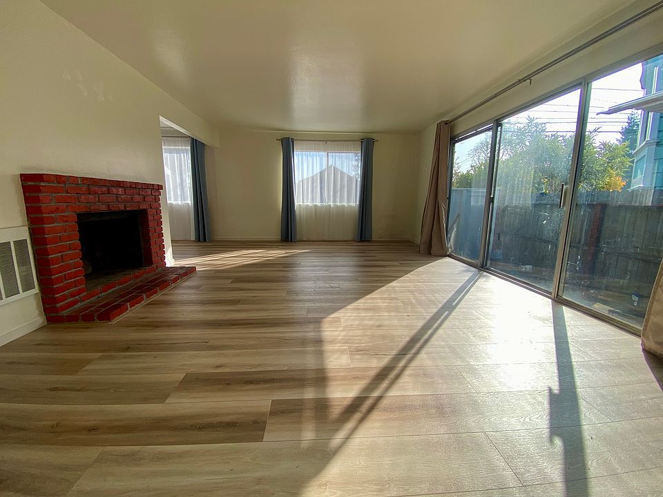 Living room. Bright. Lots of Natural Light. Private back patio.