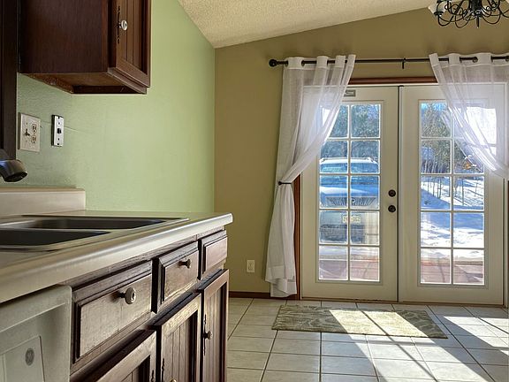 Dining area and front French doors from kitchen.