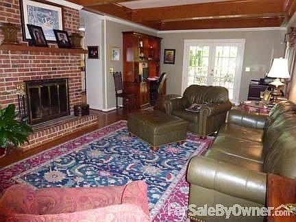 Large family room
						:
						brick fireplace with French doors leading to deck