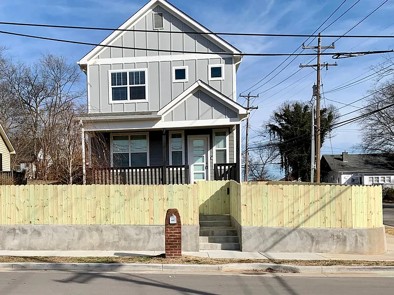 New fence encompassing front yard. Perfect for pets!