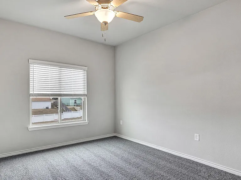 Bedrooms include plush carpet and ceiling fans