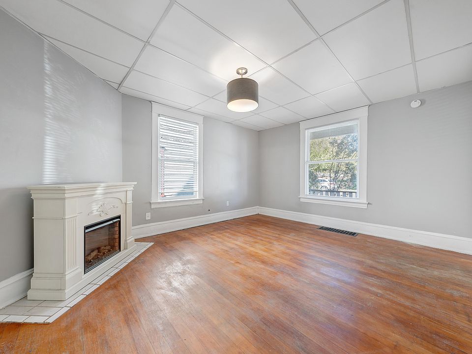 Spacious Living Room w/ Designer Lighting and Electric Fireplace!
