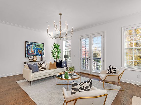 Family room with juliet balcony overlooking private community park.