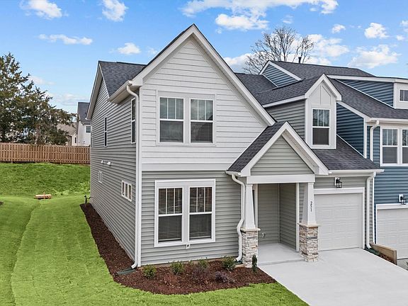 Exclusive end-unit townhome in Aspen Ridge with elegant design and high standards