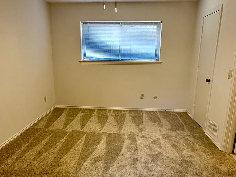 Bedroom featuring carpeted floors, could be used as optional office space.