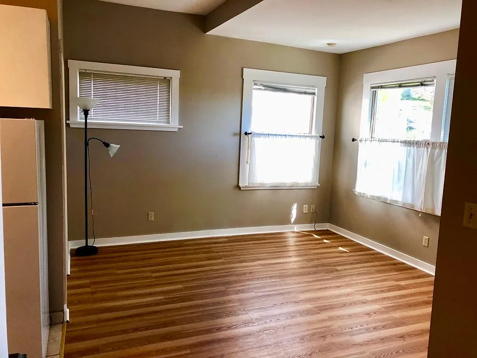 Living room with southern exposure through newer noise cancelling insulating windows
