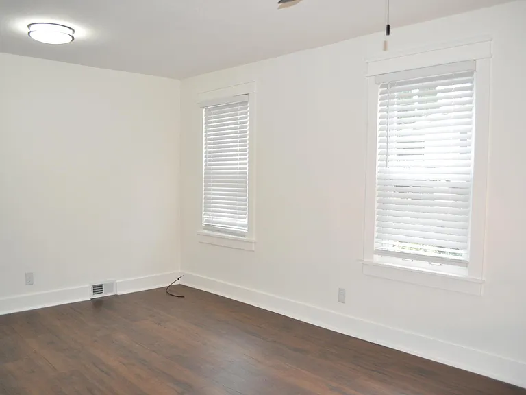 Master bedroom window treatments included.
