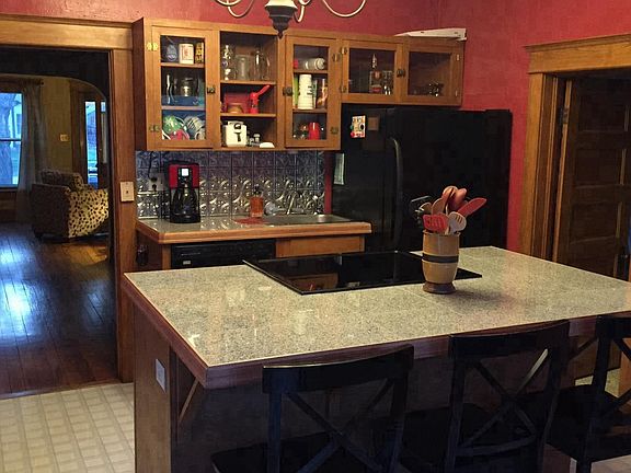 Kitchen with granite countertops and original historic cabin