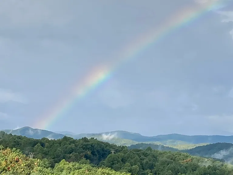 Rainbow __ over mountains