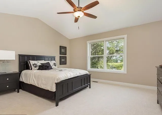 Master Bedroom with high ceiling and overlook to Pond