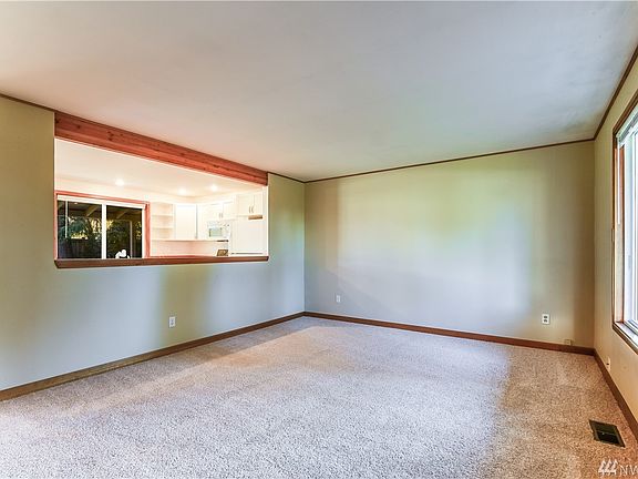 Large living room with opening to kitchen