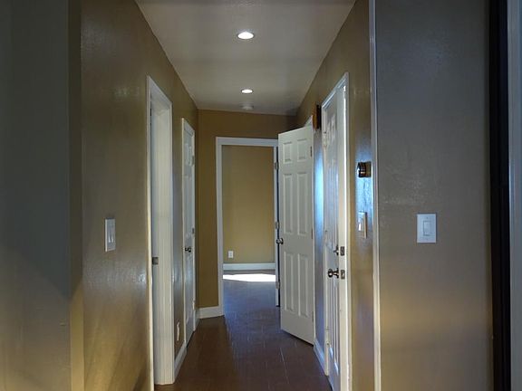 hallway to bathroom& rear bedrooms and