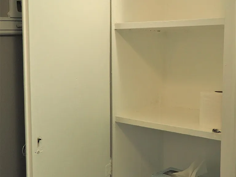 Three shelf, deep, built in bathroom cabinet