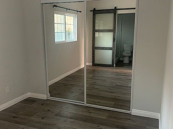 Bedroom with mirrored closet