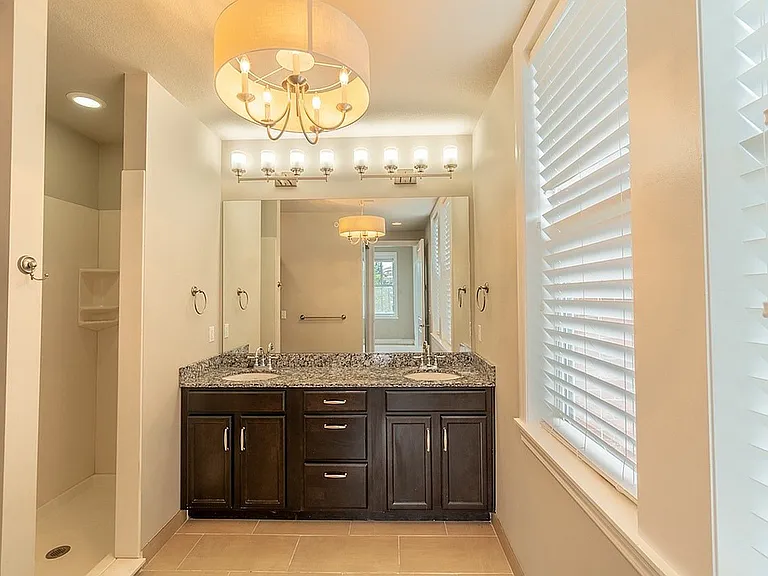 Bathroom with Double Vanity & Granite Countertop