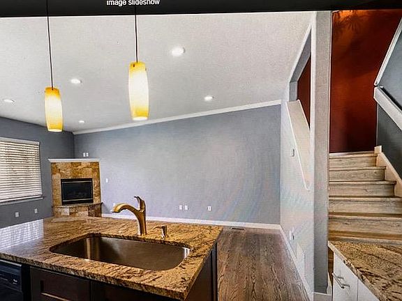 living area with stairwell going up.