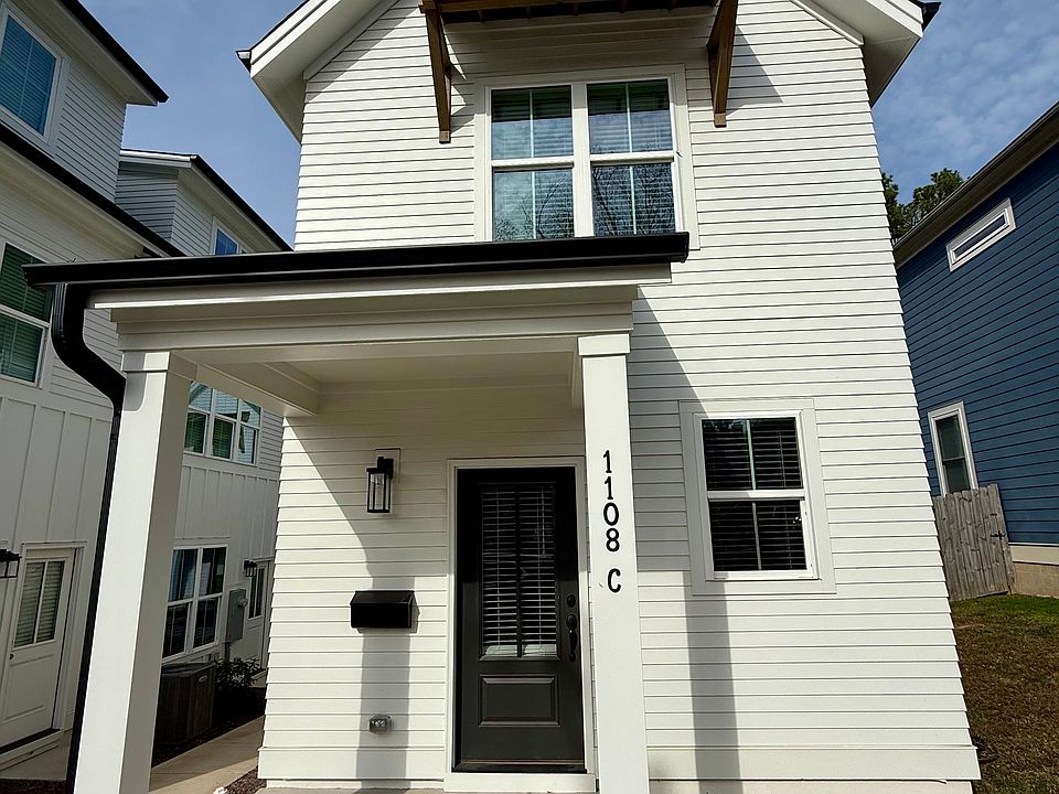 2 story cottage with a front Porch. Off Street parking next to the cottage.
