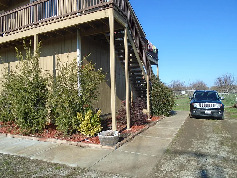 Rt. side with walkway, stairway,