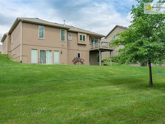 VIEW OF REAR OF HOME - SO MANY WINDOWS TO ALLOW NATURAL LIGHT