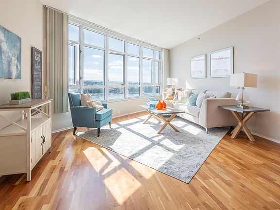 Living room with east facing, direct lake Merritt views