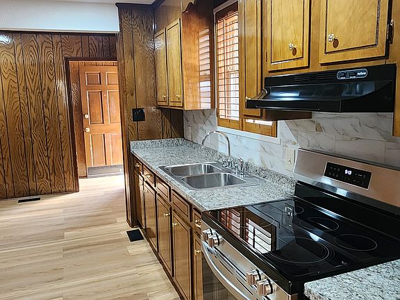 Country kitchen with combo dining area.