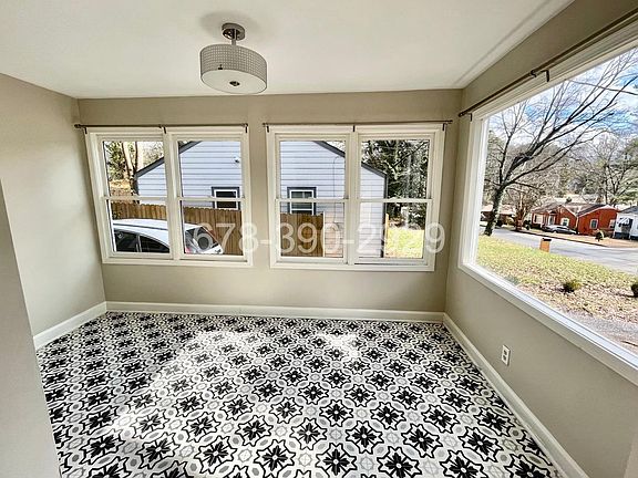 Heated/Cooled sunroom pefect den or home office