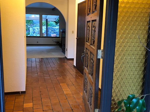 Entry off front patio, tile hall goes right to bedrooms and left open tile all passing front room & formal dining room, famiy room & kitchen