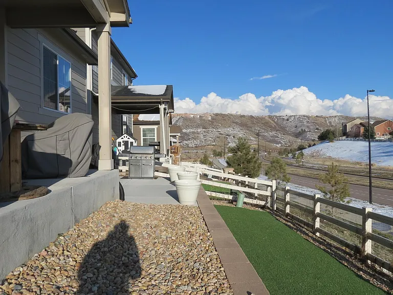 Terraced yard with topographic views. Turf = No mowing!