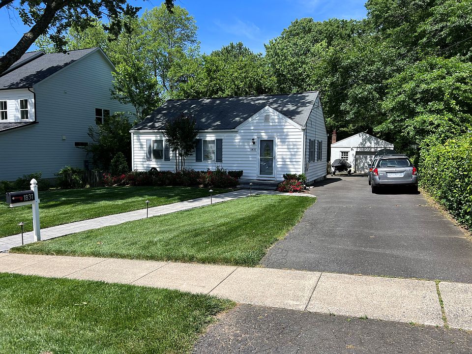 Front Yard View with Paver Walkway and Driveway