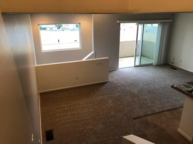 Open concept dining area and living room; patio off of living room
