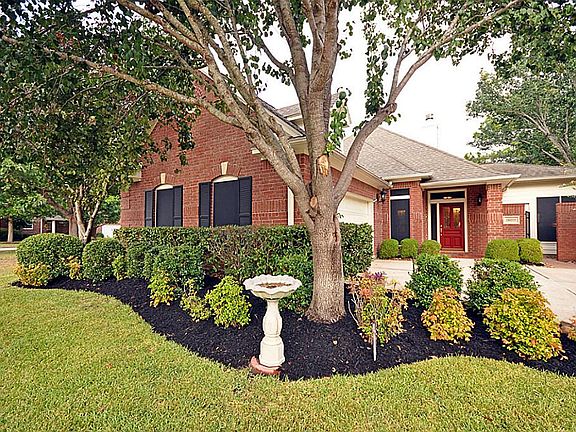 A view from the side lot. The yard also includes a full sprinkler system.
