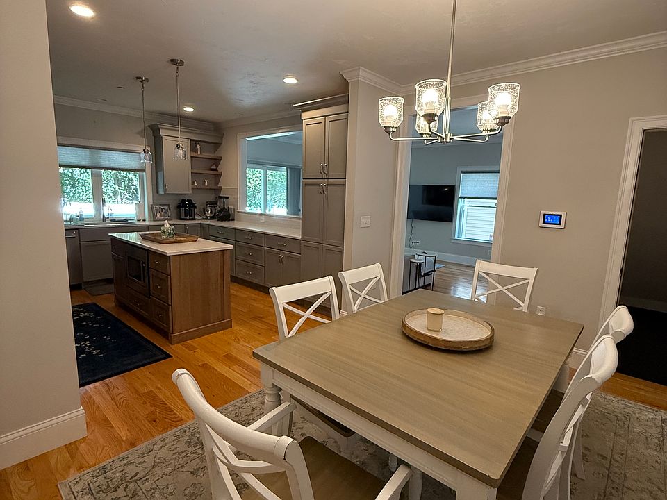 Dining area with stairs to workout room in basement