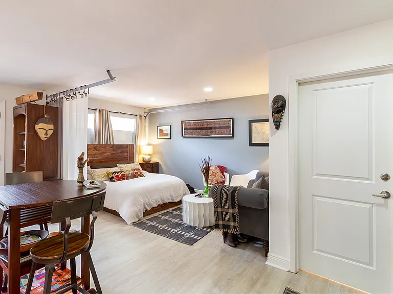 Door on right to storage, washer & dryer, and access to front house