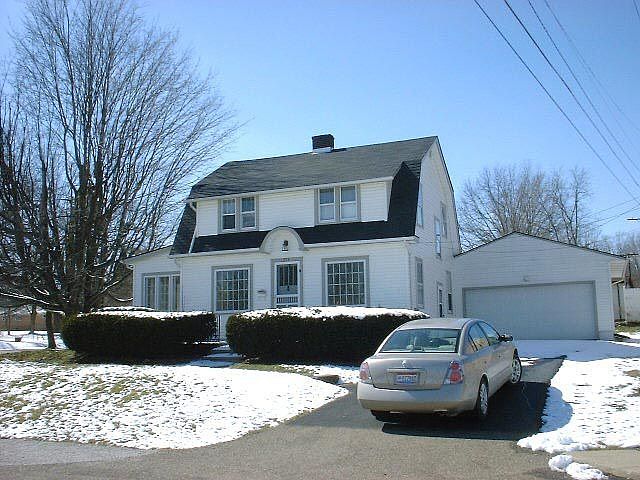house front and 2-car garage