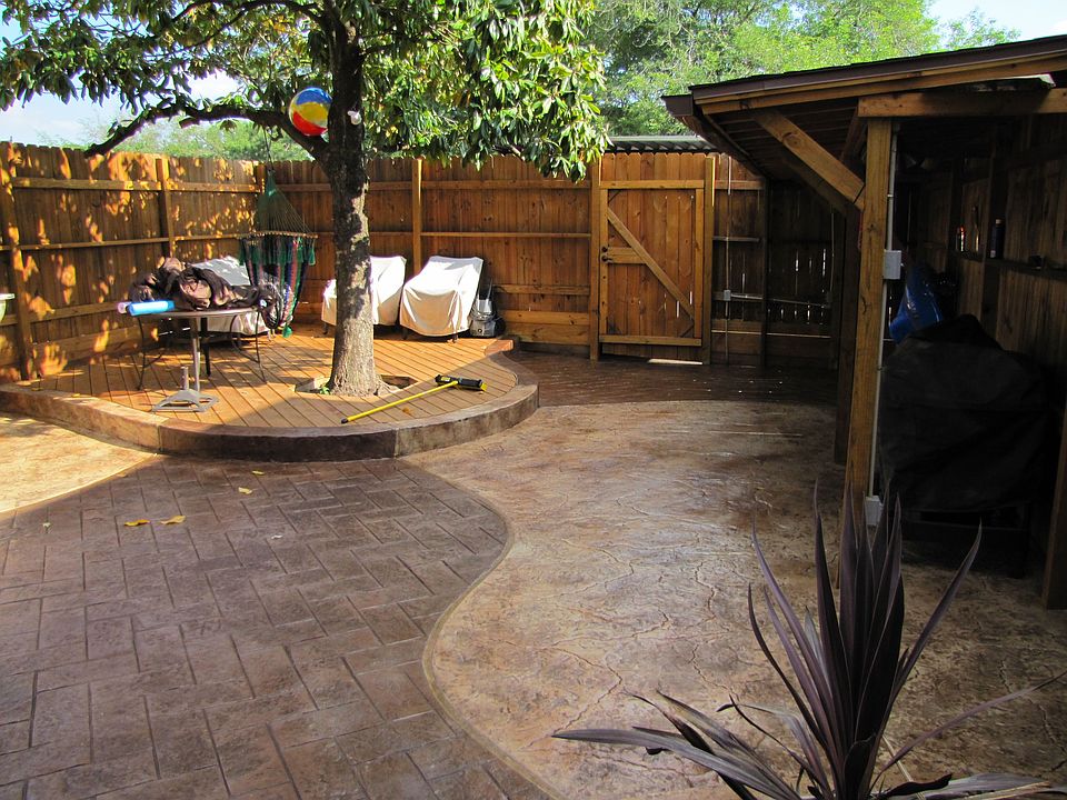 Beautiful backyard with a mature magnolia tree for great shade.