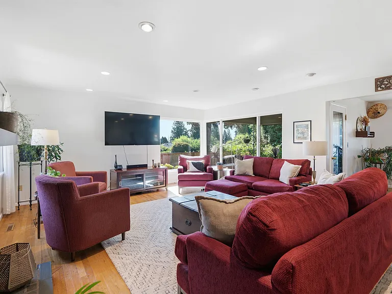 Large, bright living room with access to covered porch