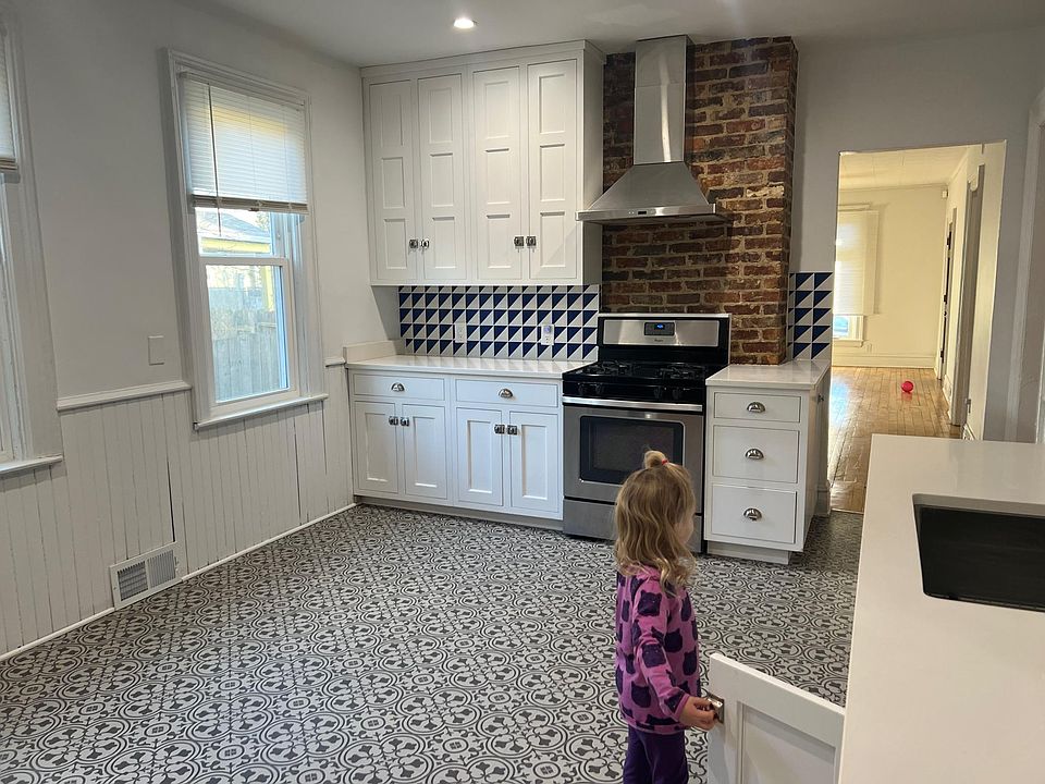 Beautifully renovated kitchen with wood cabinets.