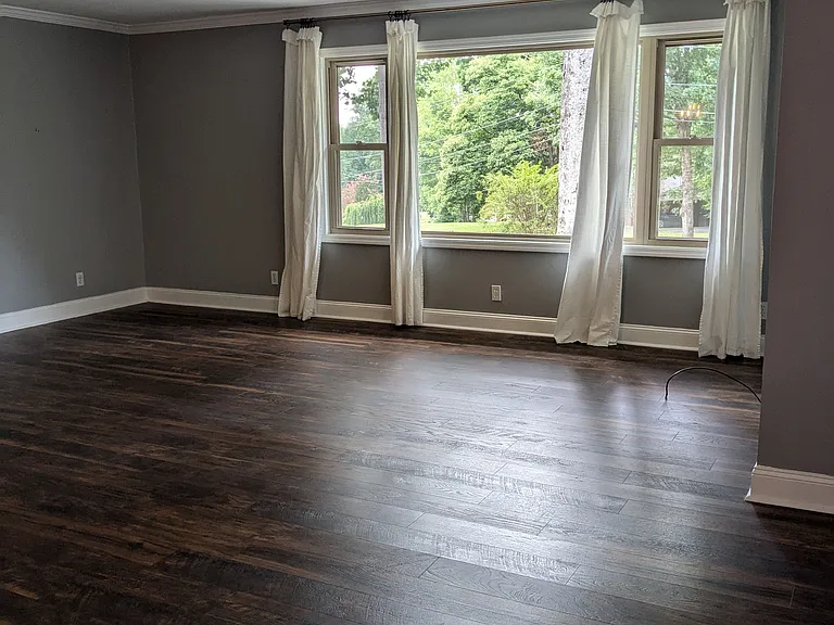 Large, bright living area looking out onto the front yard
