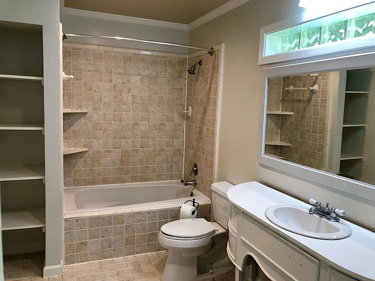 Master bathroom with additional closet storage (not pictured)