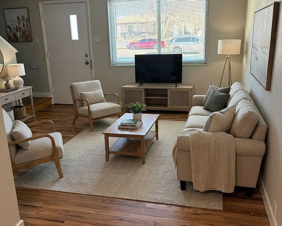 Open floorplan living room. Refinished floors and fresh paint throughout