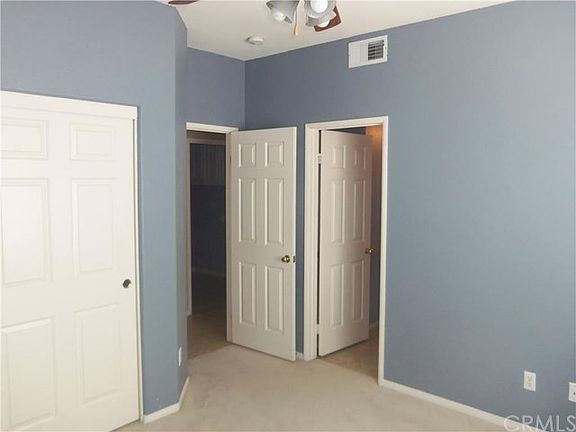Main floor bedroom connected to bathroom