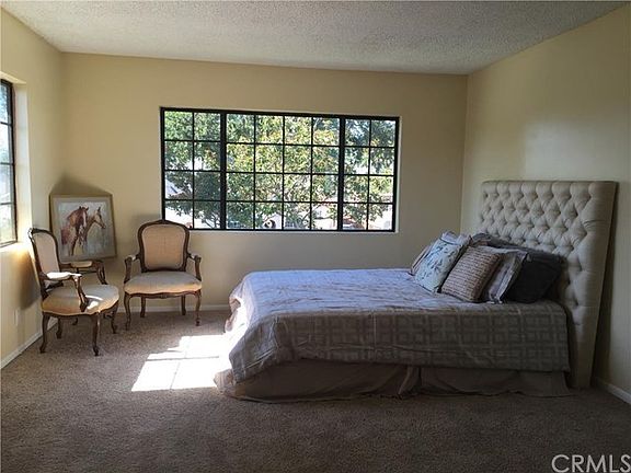 Master bedroom with lots of natural light and neighborhood views.